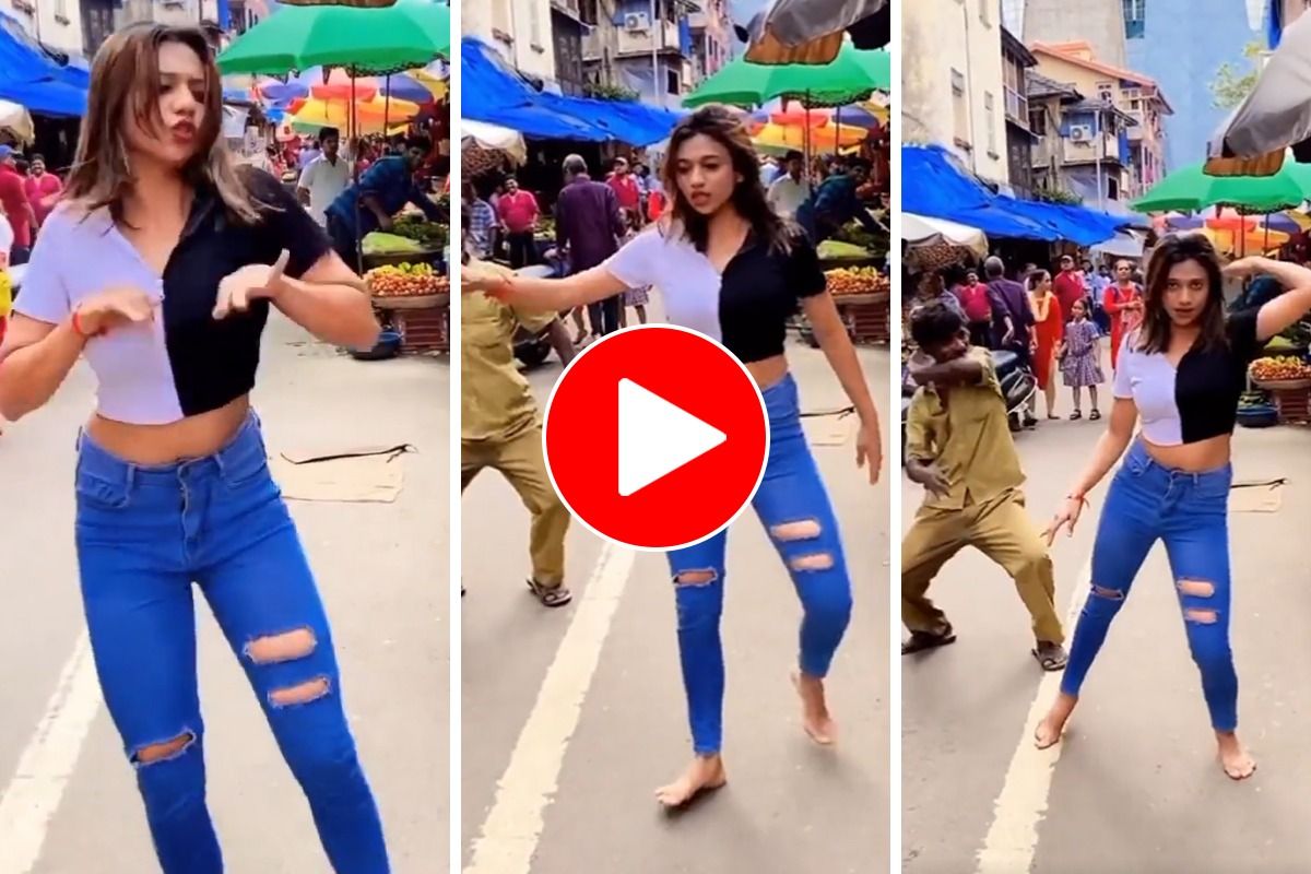 The girl was lost in the dance on the middle of the road, then uncle arrived and left after being blown away