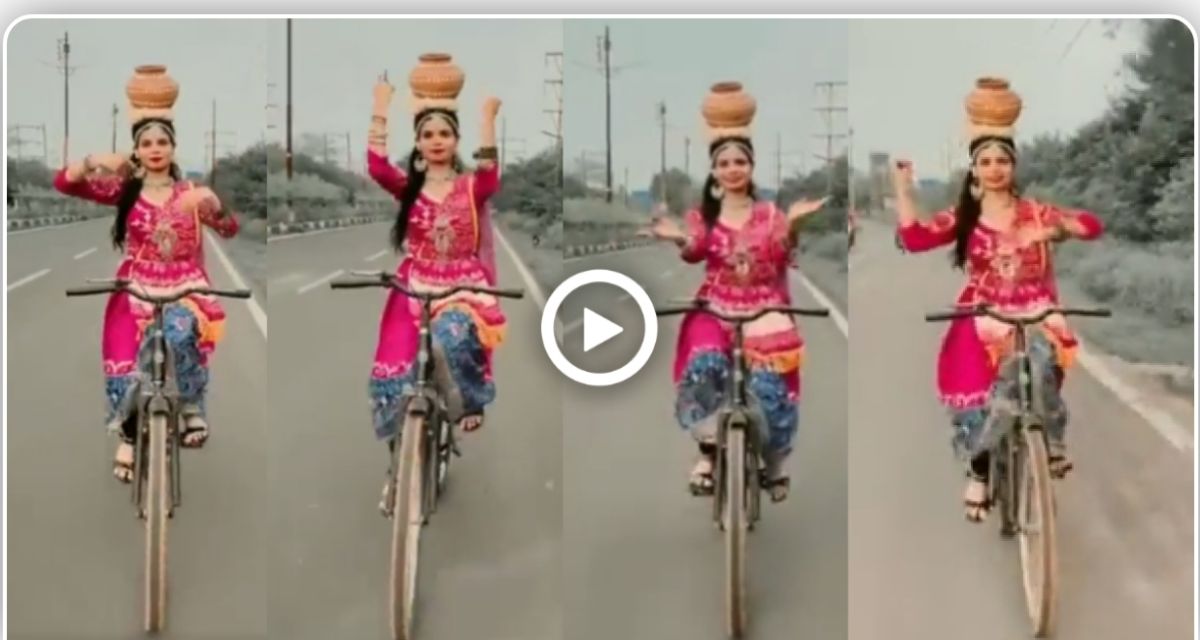 Video of a girl doing classical dance on a cycle with a vase on her head went viral