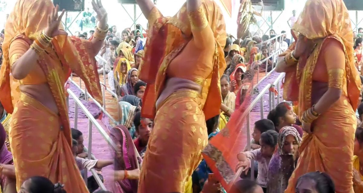 Women dance in rustic style in village satsang