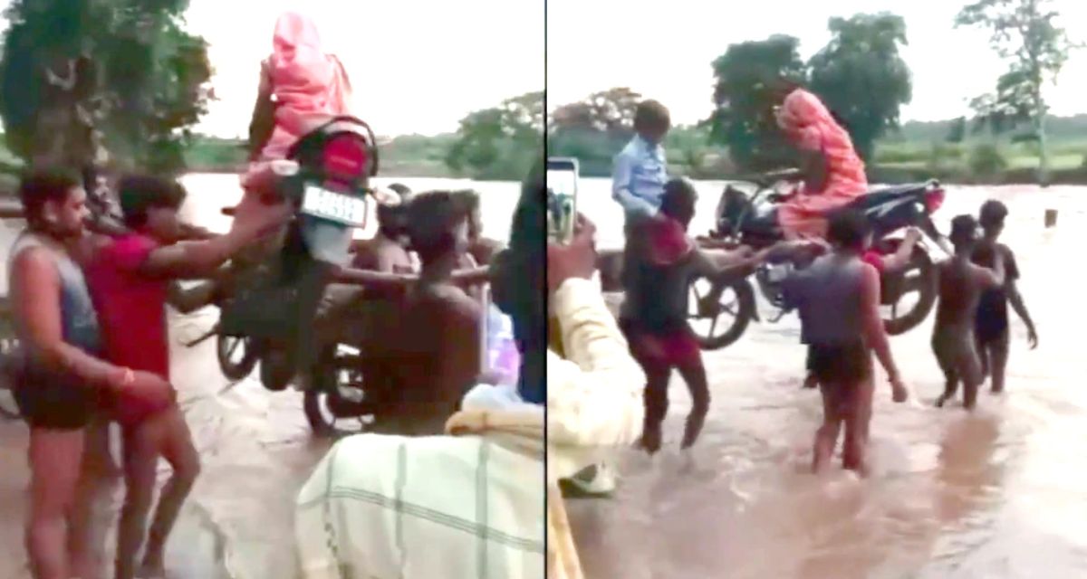 The woman trapped in the flood was made to cross by sitting in a bike